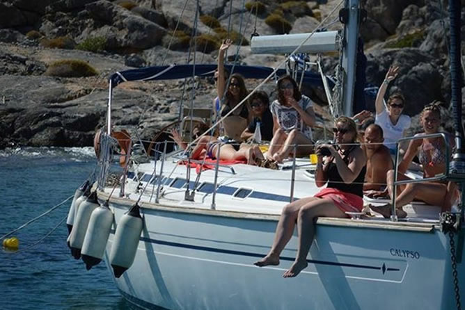 Sailing boat trip in Crete during day or sunset